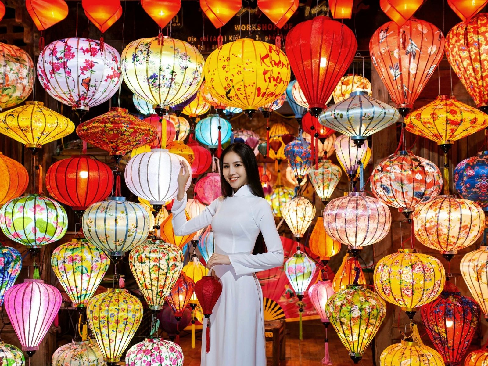Itinerary Vietnam Vegan Travel Traveller surrounded by colourful lanterns in Hoi An, Vietnam