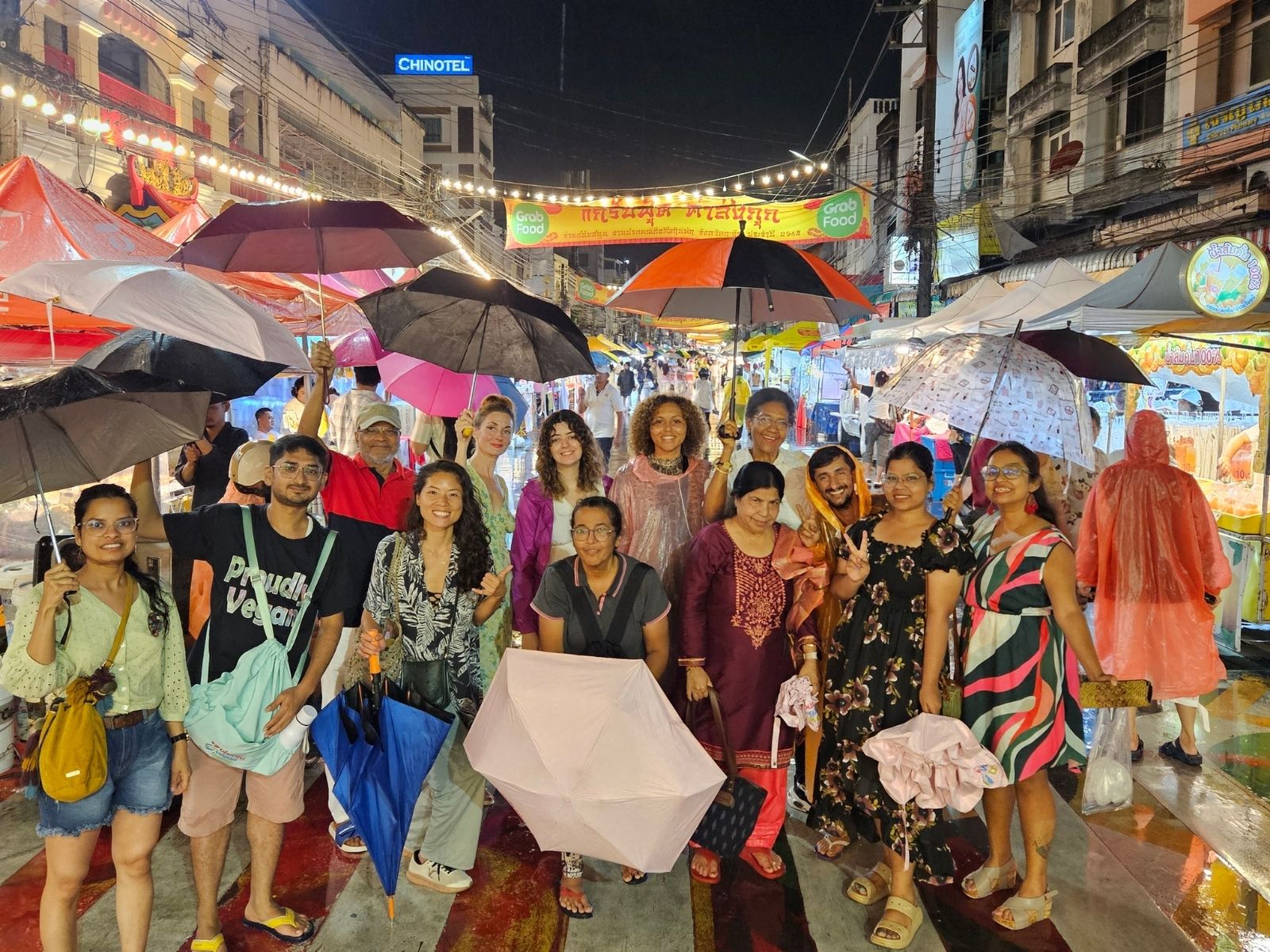 Vegan travel group exploring the vibrant Phuket Vegetarian Festival in Thailand