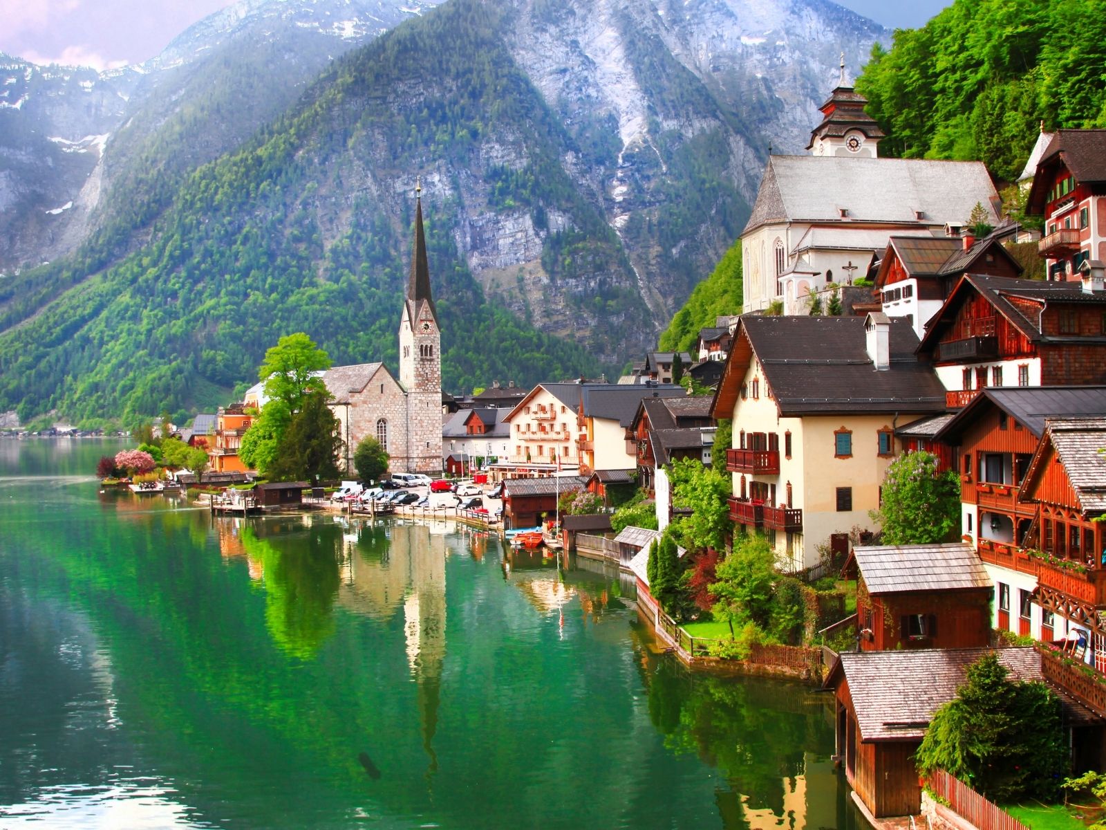 Hallstatt village reflected in the lake at sunrise, Austria
