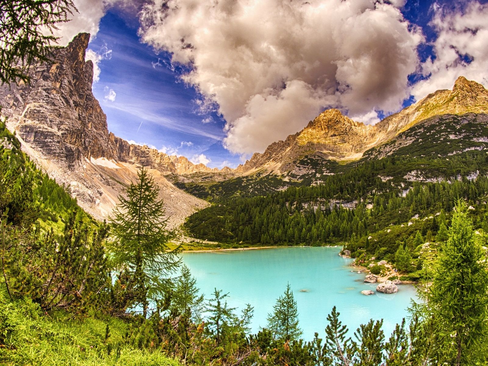 Emerald alpine lake surrounded by dramatic mountains in Slovenia