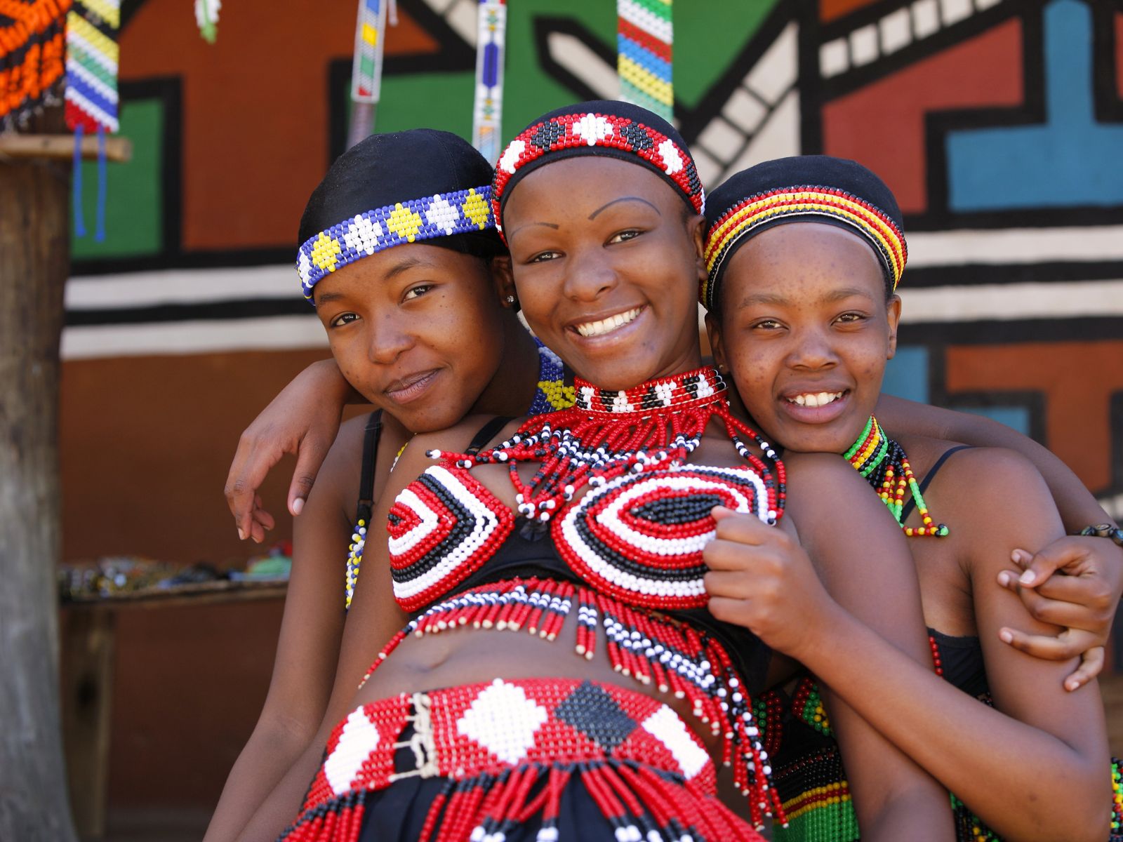 Itinerary South Africa Vegan Safari Zulu women wearing colourful traditional beadwork during a cultural experience in South Africa